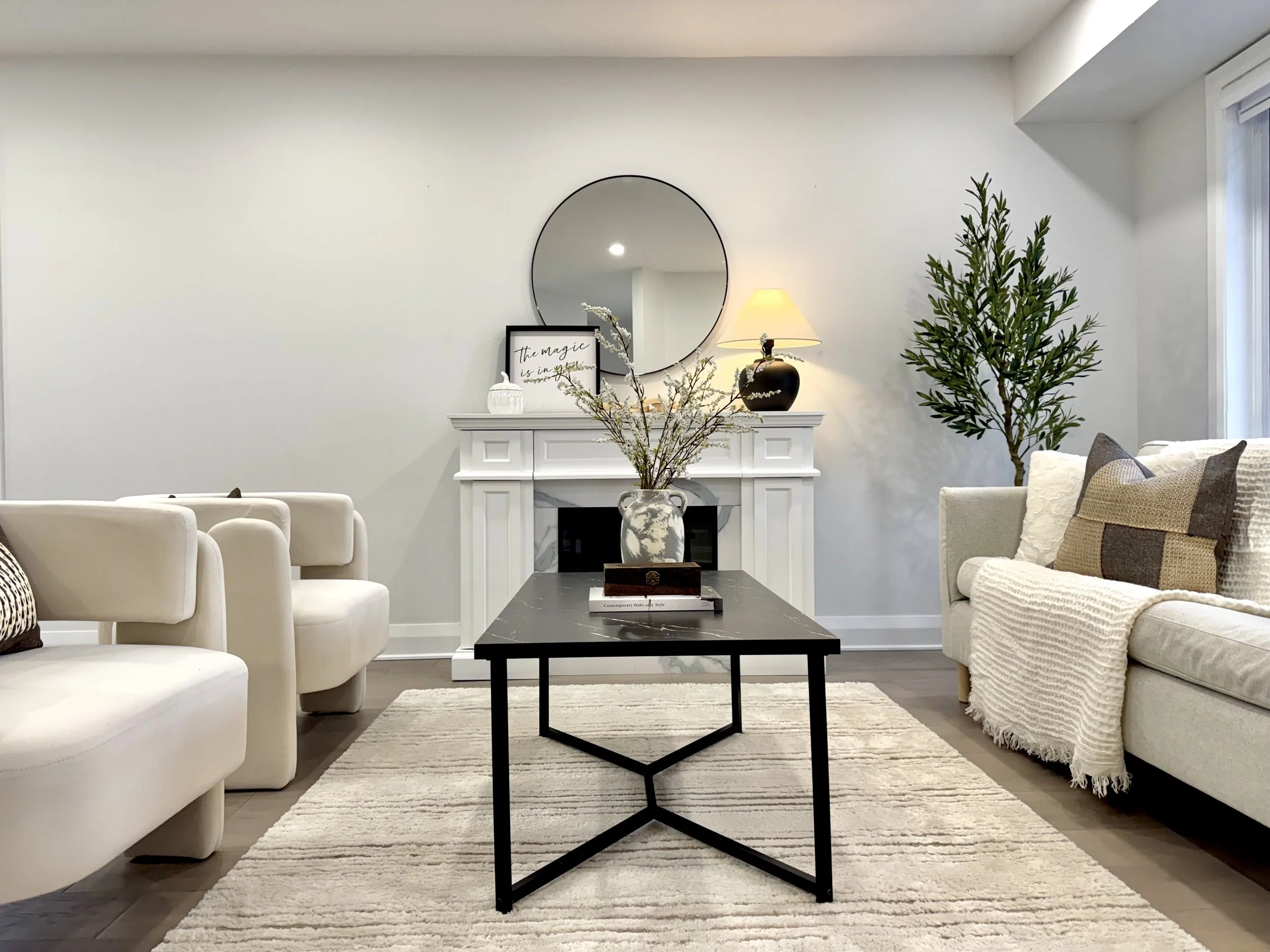 Living room arranged around a fireplace by DW Home Décor